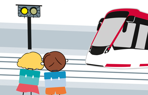 Zeichnung Kinder vor Gleisen. Doppelblinker leuchtet gelb. Von rechts kommt eine Bahn..