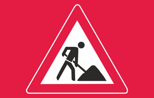 Roter Hintergrund mit Warndreieck, dass auf Bauarbeiten hinweist.